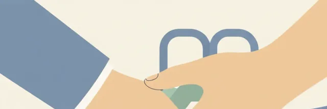 Two large adult hands gently gripping a small child's wrist, the child's feet just off the ground, with a playground slide visible softly in the background