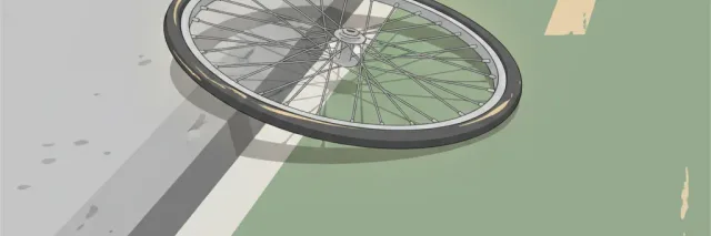 A lone bicycle wheel seen from a low angle beside a faded painted bike lane stripe, flat vector illustration.