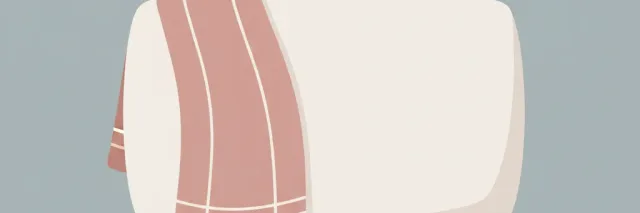 A single pale rounded sofa cushion with a soft thin blanket folded over one edge, viewed from a low angle against a muted grey-blue background, flat vector illustration.