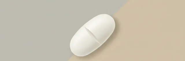 A single white oval pill resting on a pale neutral background, flat vector illustration.