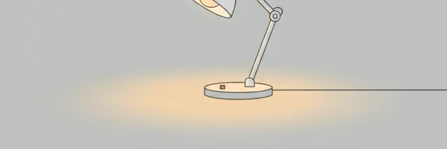 A single dim desk lamp casting a small pool of warm light on an empty pale grey surface, flat vector illustration.