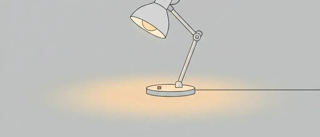 A single dim desk lamp casting a small pool of warm light on an empty pale grey surface, flat vector illustration.