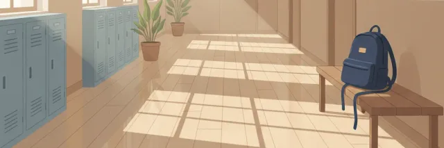 An empty school hallway with sunlight streaming through windows, symbolizing the quiet prevalence of teen mental health struggles