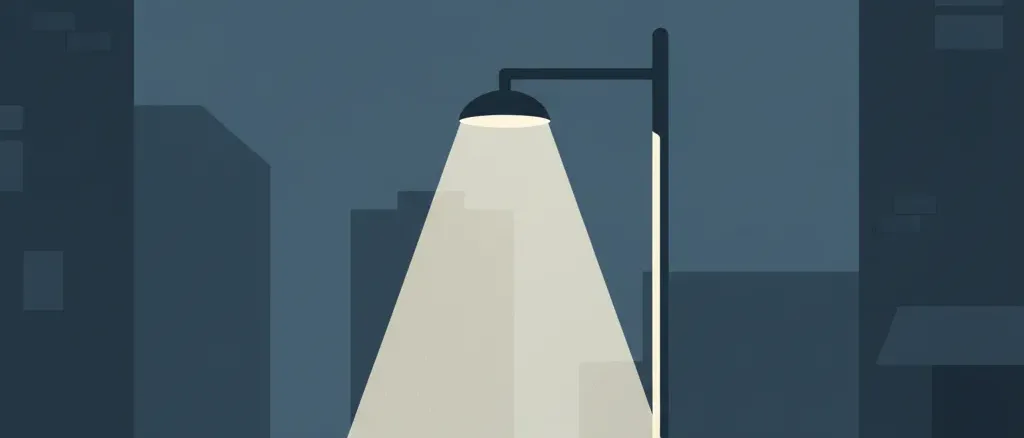 A single streetlight casting a pale cone of light on an empty sidewalk, flat vector illustration in muted dark blues and greys.