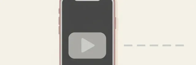 A single muted smartphone screen showing a small play-button icon, resting flat on a pale surface with a faint lane-marker stripe beside it, flat vector illustration.